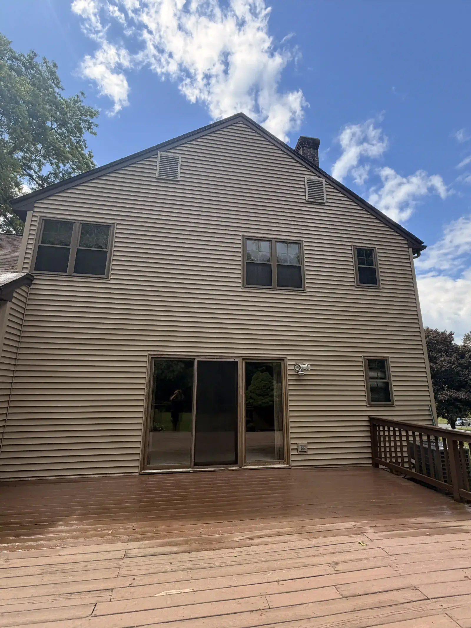 Freshly cleaned gray shutters 1 after a pressure washing visit in Southwick, MA