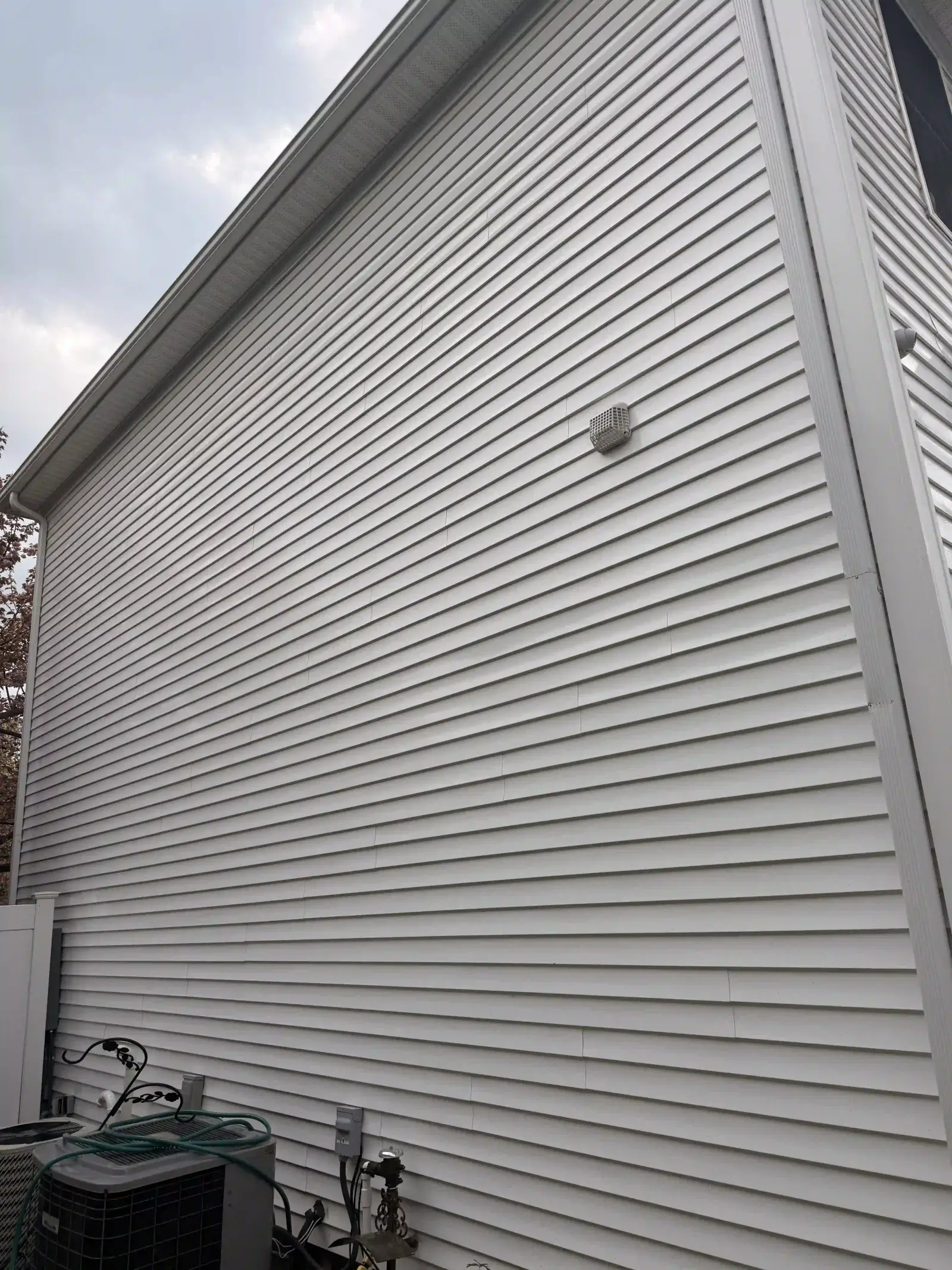 Freshly cleaned brown house angle 2 after a pressure washing visit in East Longmeadow, MA