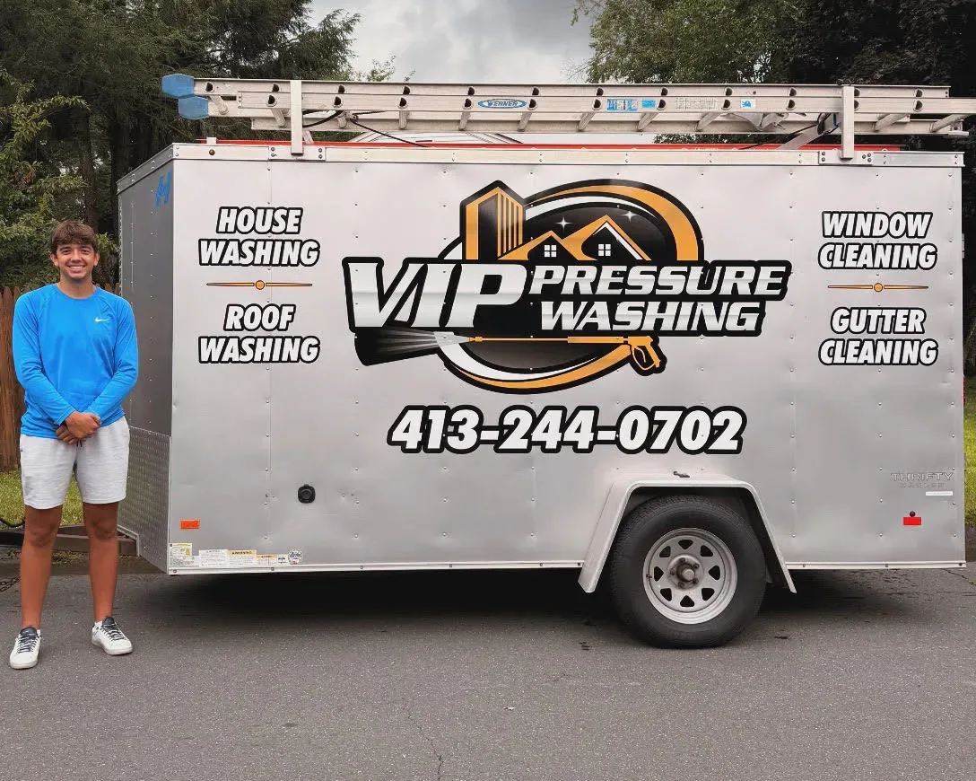 Josh Drumm with the VIP Pressure Washing trailer in Southwick, MA, listing house washing, roof washing, window cleaning, and gutter cleaning
